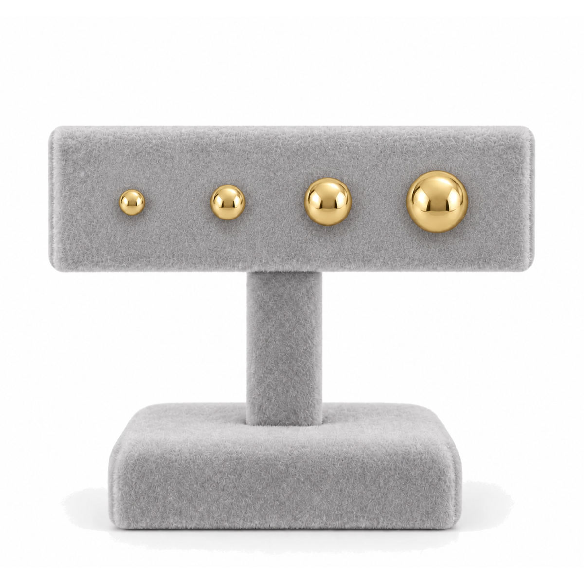 9ct gold plain ball studs in four sizes side by side on a stand