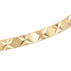Close detail of the diamond cut pattern on a 9ct gold bangle