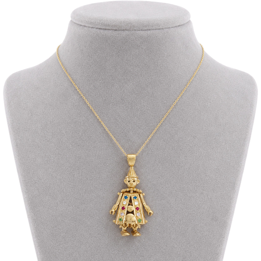 9ct gold movable clown pendant worn on a chain on a bust form