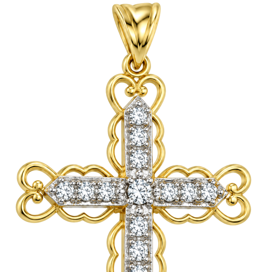 Close detail of the scrolled filigree arms and the set cubic zirconia on a 9ct gold cross pendant