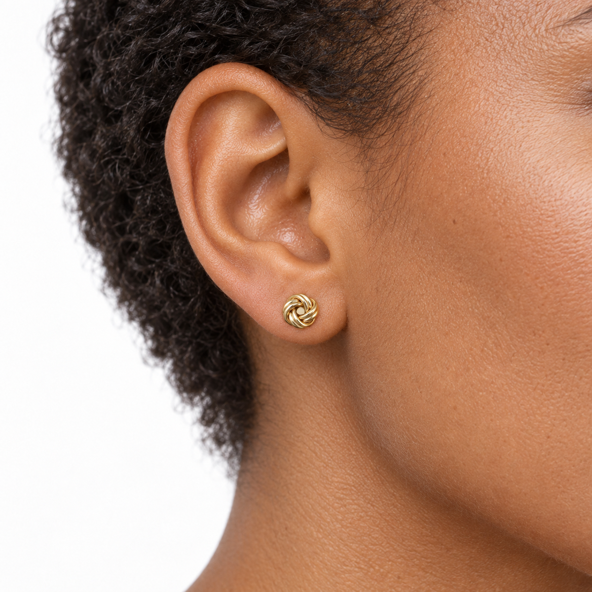 9ct gold double knot stud earring worn in the ear