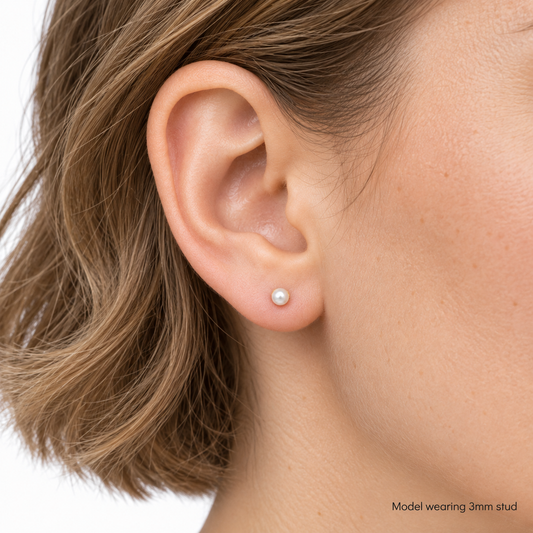 9ct gold pearl stud earring worn in the ear, labelled as the 3mm