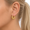 9ct gold round creole spike earring worn in the ear