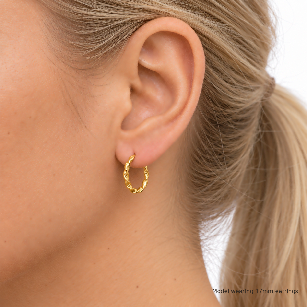 9ct gold round twist hoop earring worn in the ear, the 17mm size